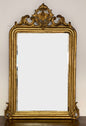 Specchiera Luigi Filippo lombarda in legno dorato e intagliato . XIX secolo