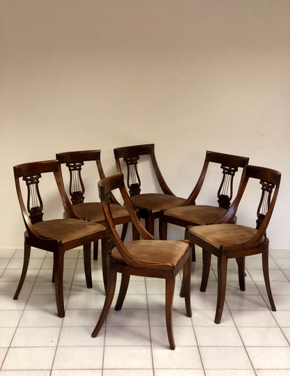 Group of six walnut chairs. Late 19th century
