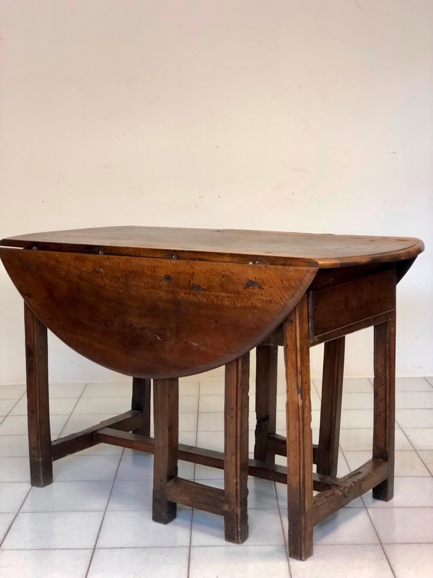 Walnut hinged table. 17th century