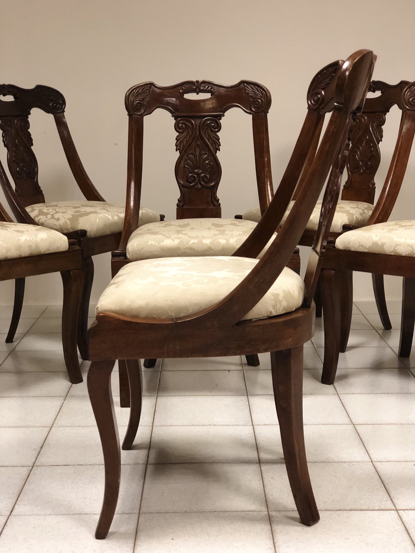 Six walnut gondola chairs. Early 19th century Lombardy