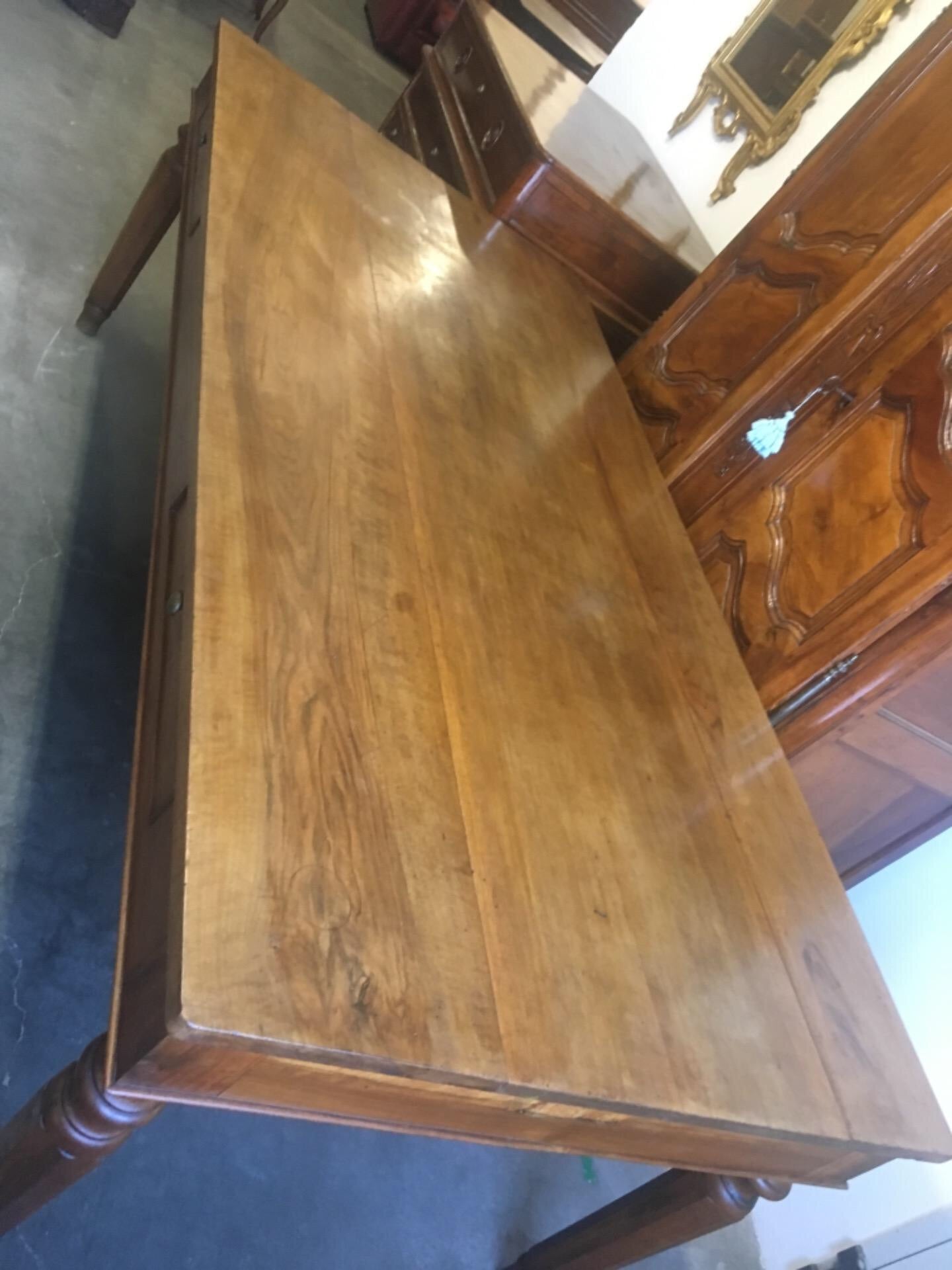 Walnut table from the Charles X era with truncated pyramid legs. 233 X 108