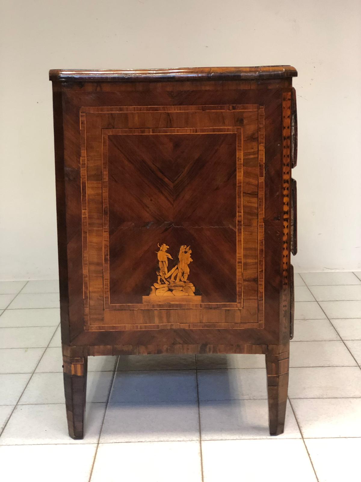 Louis XVI Lombard chest of drawers with figures. 18th century
