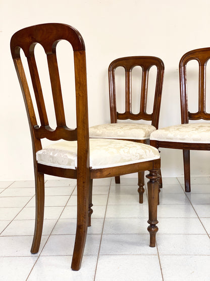 Group of four Lombard walnut chairs, mid-19th century