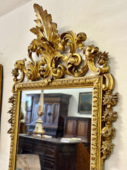 Specchiera lignea intagliata dorata . Toscana inizio XIX secolo
