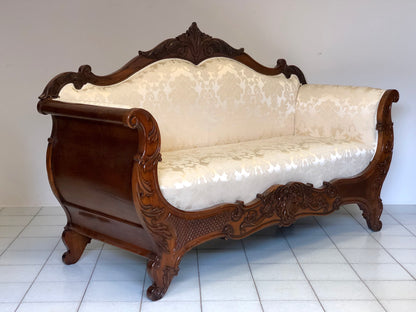 Lombard boat-shaped sofa in walnut Charles X