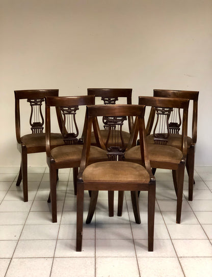 Group of six walnut chairs. Late 19th century
