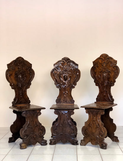 Group of three carved stools. 19th century