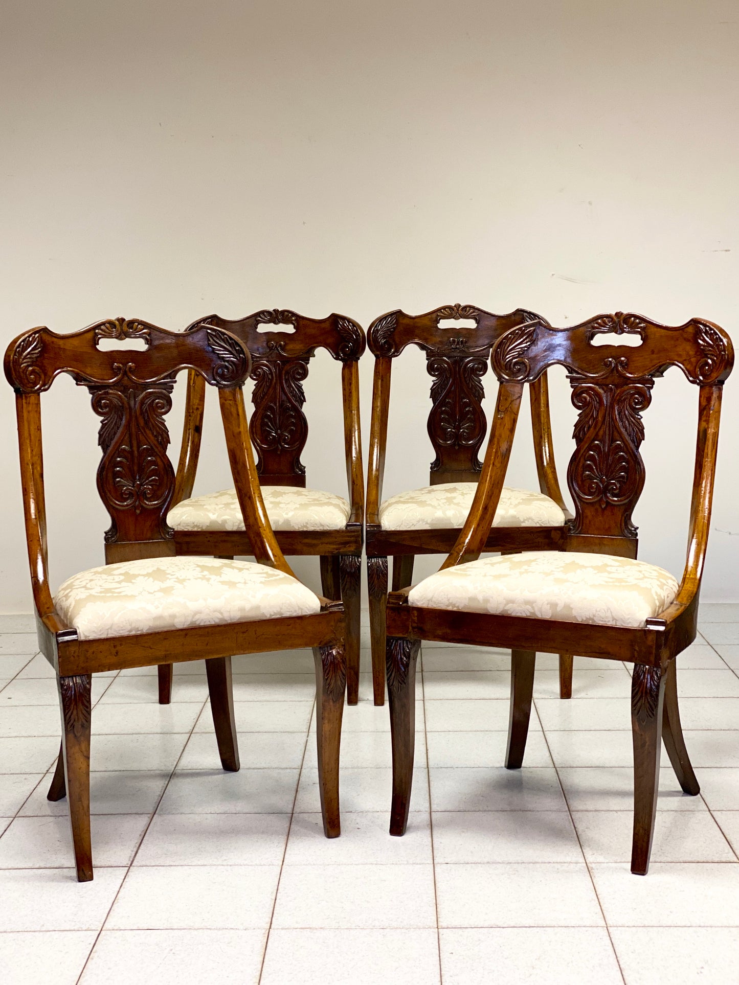 Group of four Lombard Charles X gondola empire chairs. Early 19th century
