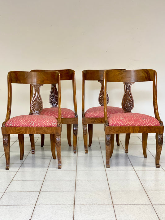 Group of four Empire walnut tub chairs. 19th century