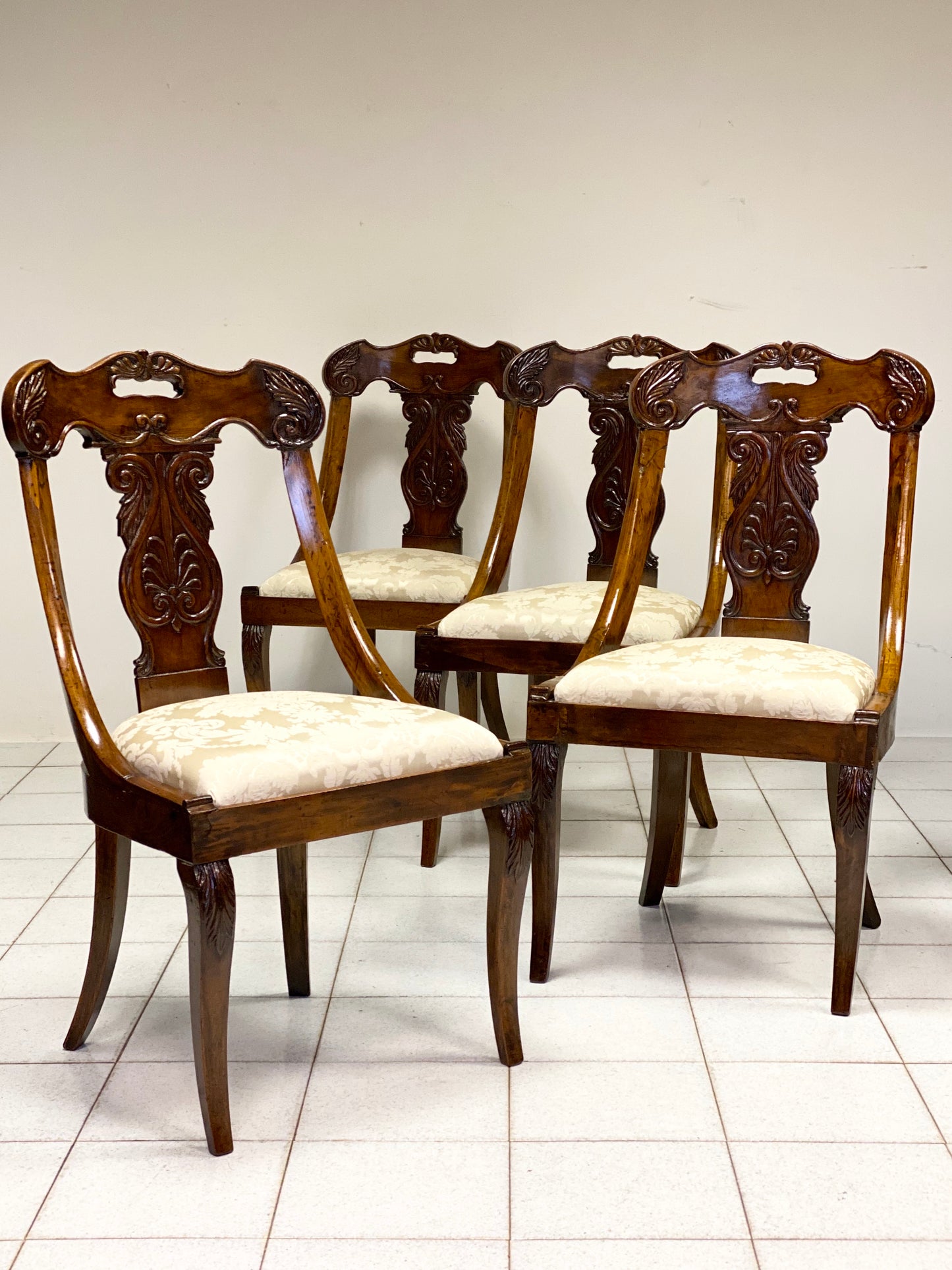 Group of four Lombard Charles X gondola empire chairs. Early 19th century