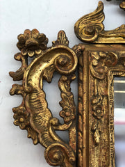 Specchiera lombarda in legno intagliata e dorata in oro zecchino