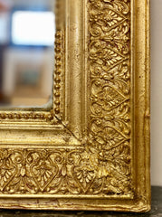 Specchiera in legno dorato intagliato . XIX secolo
