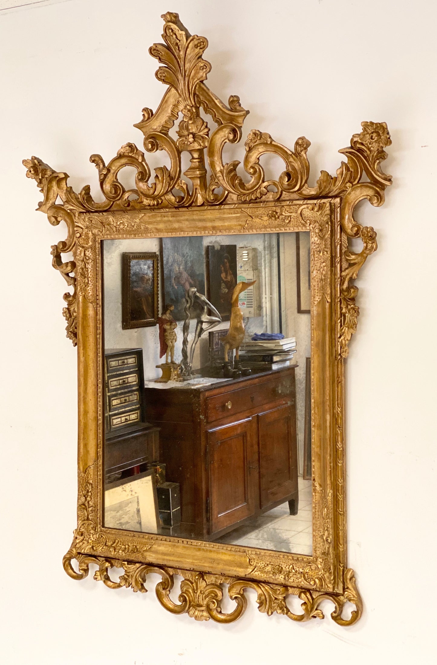 Venetian mirror in carved gilded wood. Late 19th century