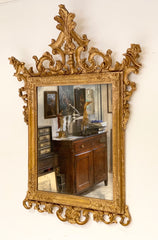 Specchiera veneziana in legno intagliato dorato. Fine XIX