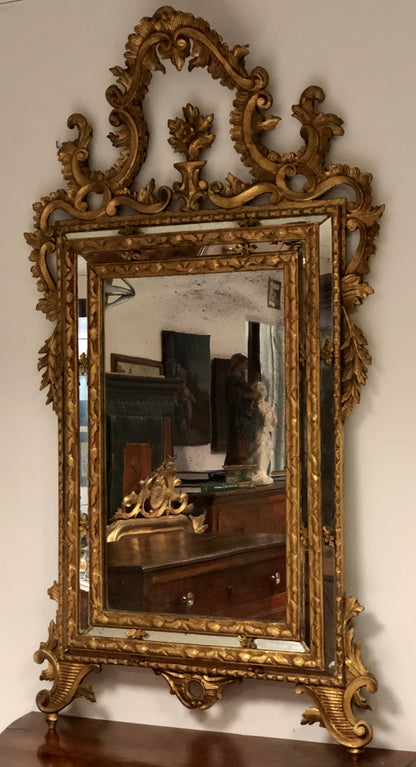 Carved and gilded wooden mirror, late 19th century