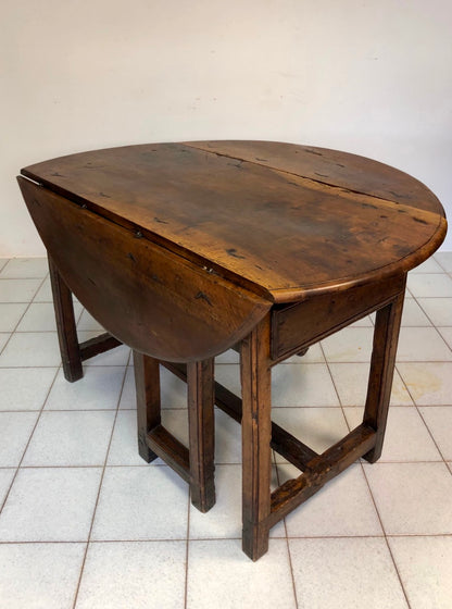 Walnut hinged table. 17th century