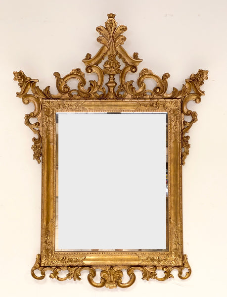 Specchiera veneziana in legno intagliato dorato. Fine XIX