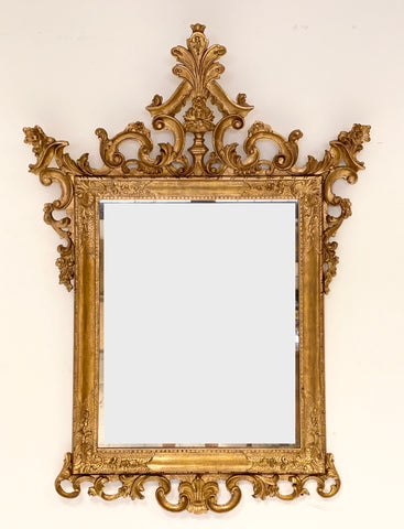 Specchiera veneziana in legno intagliato dorato. Fine XIX