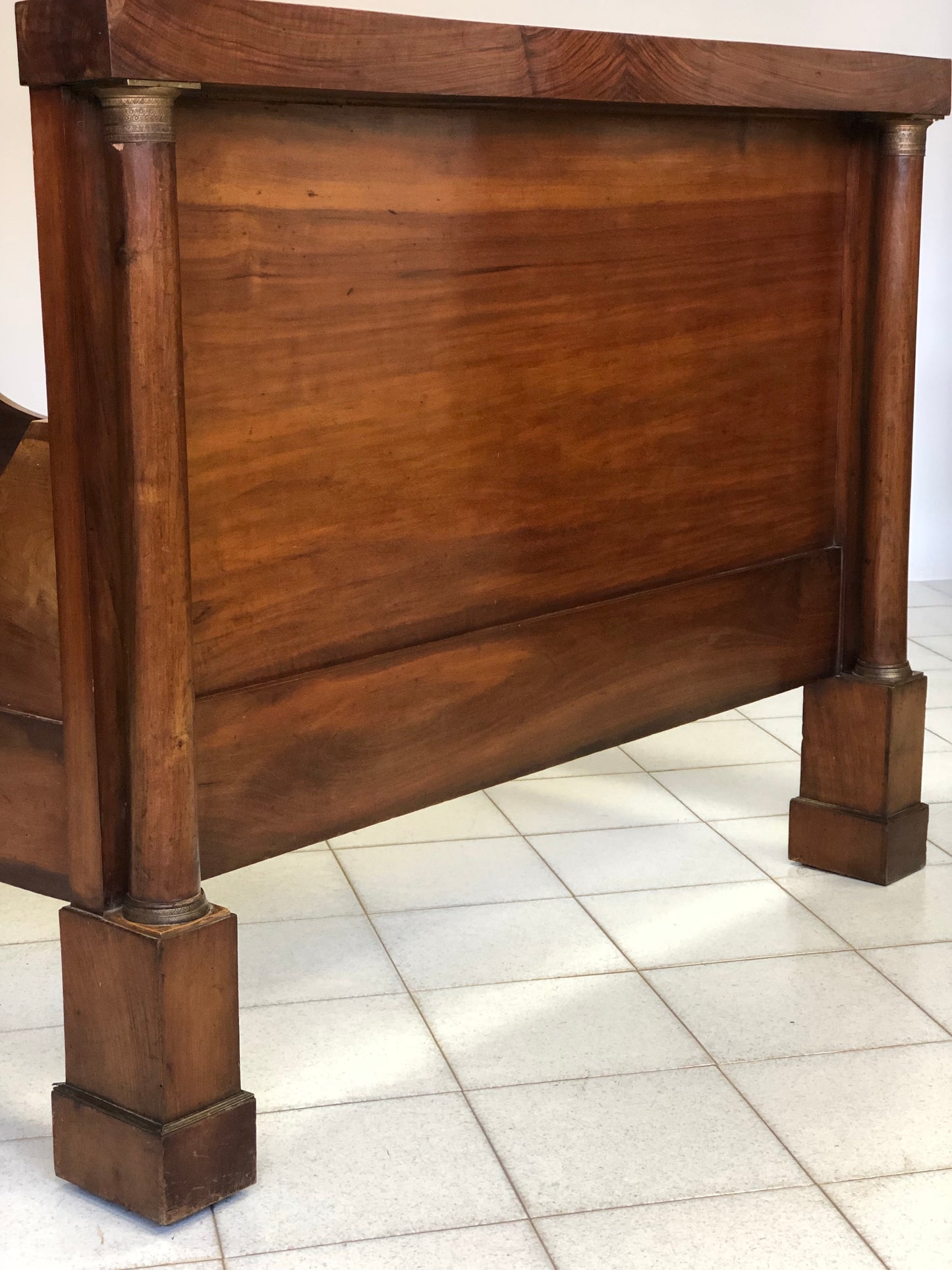 Lombard Empire three-quarter walnut bed. First half of the 19th century