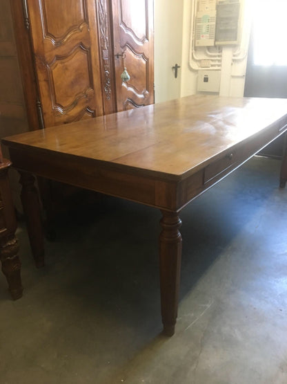 Walnut table from the Charles X era with truncated pyramid legs. 233 X 108