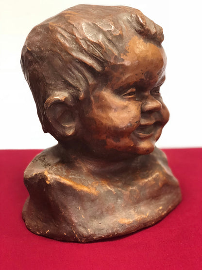 Testina di fanciullo in terracotta dell' 800