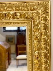 Specchiera lignea intagliata e dorata . Prima metà XIX secolo