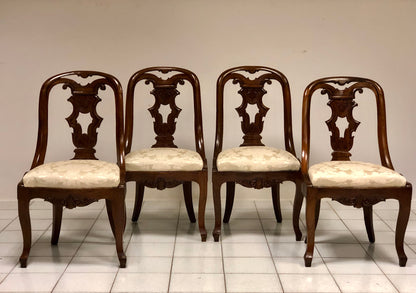 Group of four Charles X gondola chairs. Early 19th century