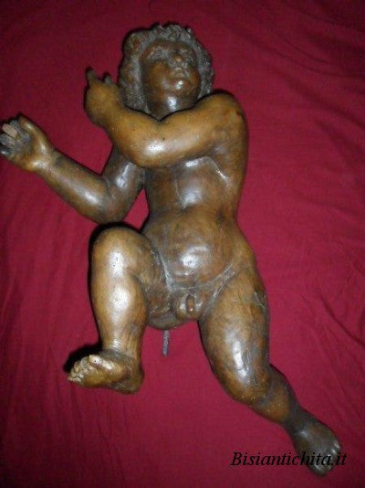 Putto in legno di noce del Cinquecento
